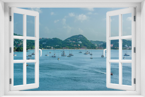 Fototapeta Naklejka Na Ścianę Okno 3D - A view towards small boats moored in St Georges Bay in Grenada