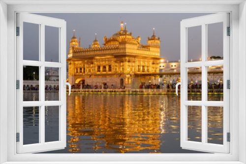 a medium view of the famous golden temple at dusk in amritsar