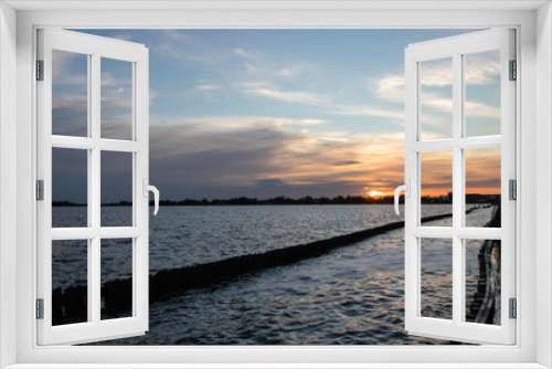 Fototapeta Naklejka Na Ścianę Okno 3D - Sunset over the lake.