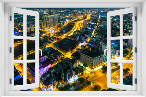Fototapeta Naklejka Na Ścianę Okno 3D - Night cityscape from above with lightstreet riverside create shimmering nocturnal beauty city developing dynamically in Ho Chi Minh City, Vietnam