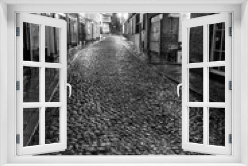 Fototapeta Naklejka Na Ścianę Okno 3D - lonely rainy cobbled street and night