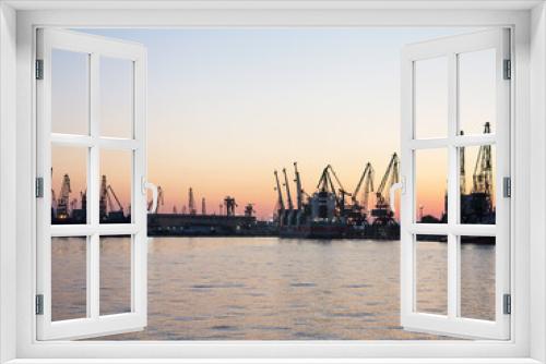 Fototapeta Naklejka Na Ścianę Okno 3D - Varna, Bulgaria - July 23, 2016: View on seaport with cranes, cargo and passenger ships at sunset, Varna.