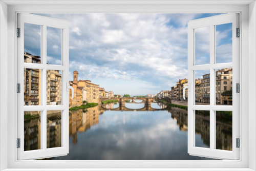 Fototapeta Naklejka Na Ścianę Okno 3D - FLORENCE / ITALY - MAY 6 2017: Santa Trinita bridge reflected in the Arno river seen from Ponte Vecchio.