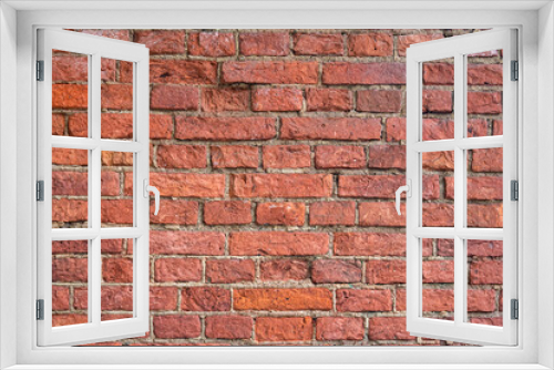 Fototapeta Naklejka Na Ścianę Okno 3D - The brick wall is a warm shade. The pattern of the old bricks. Red-brown construction hair dryer. Old brick walls close-up.