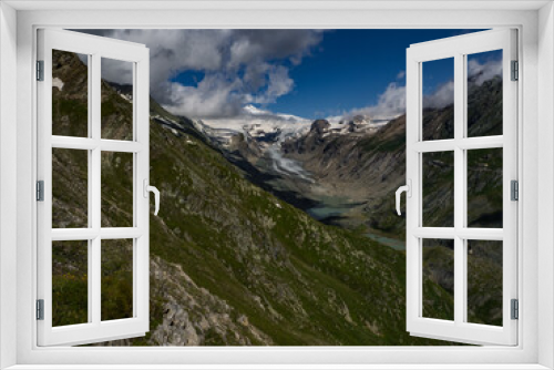 Fototapeta Naklejka Na Ścianę Okno 3D - The best scenic view to the valley under the highest mountain Grossglockner with glaciers cover with snow and unique lakes under him in Hohe Tauern national park, near Heiligenblut, Austria, Europe.