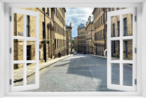 Fototapeta Naklejka Na Ścianę Okno 3D - Burnett Street, with old textile mills in, East Germany, Bradford, UK
