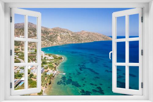 Fototapeta Naklejka Na Ścianę Okno 3D - Aerial drone view of a beach surrounded by crystal clear shallow ocean (Haviana Beach, Crete, Greece)