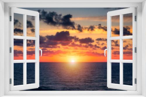 Fototapeta Naklejka Na Ścianę Okno 3D - Beautiful sunset/sunrise over the sea. Beautiful sunset over the ocean. Beautiful sunset over sea with reflection in water, majestic clouds in the sky