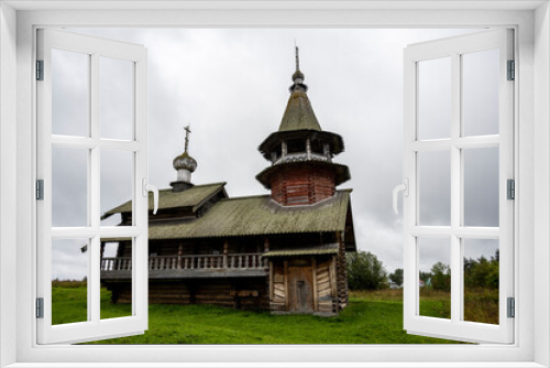 Fototapeta Naklejka Na Ścianę Okno 3D - wooden ancient church on the island among the trees during the rain