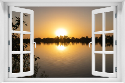 Fototapeta Naklejka Na Ścianę Okno 3D - Beautiful sunset on the river.