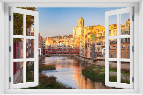 Fototapeta Naklejka Na Ścianę Okno 3D - Panoramic of Girona from the bridge of the river Onyar, where you can see the bell tower of the Cathedral. Girona, Catalonia, Spain