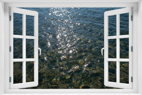 Fototapeta Naklejka Na Ścianę Okno 3D - Full frame transparent sea water, illuminated by the sun.