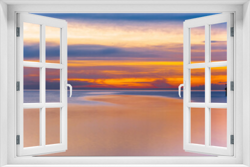 Fototapeta Naklejka Na Ścianę Okno 3D - Long exposure minimalist sunset over sea with text space. Beautiful vivid golden orange colors