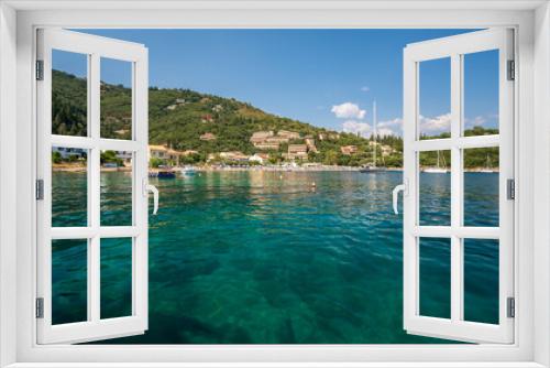 Fototapeta Naklejka Na Ścianę Okno 3D - The clear waters of Kalami Bay, in Corfu, Greece, on a bright summers day