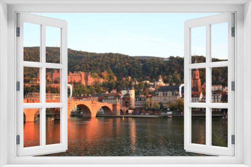 Fototapeta Naklejka Na Ścianę Okno 3D - View of Heidelberg old town and Castle with Old Bridge over the river Neckar during sunset in autumn in Heidelberg, Germany