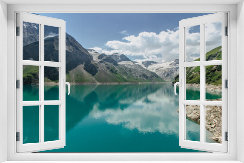 Fototapeta Naklejka Na Ścianę Okno 3D - Beautiful view of high mountain lake near Kaprun.Hike to the Mooserboden dam in Austrian Alps.Quiet relaxation in nature.Wonderful nature landscape,turquoise tranquil lake,holiday travel scene