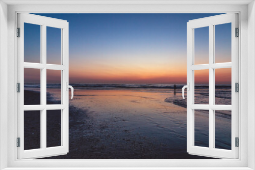 Fototapeta Naklejka Na Ścianę Okno 3D - Sunset at North Sea Kijkduin Beach in the Netherlands where the land, sea and sky meet
