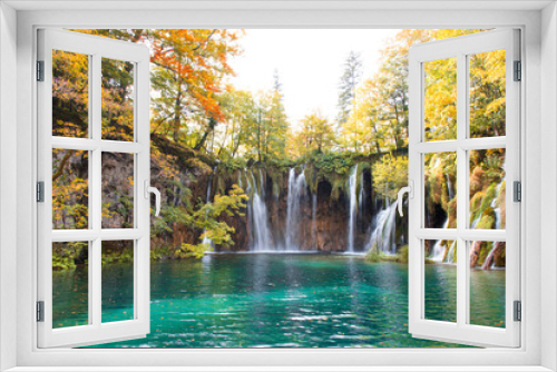 Fototapeta Naklejka Na Ścianę Okno 3D - Autumn landscape with waterfalls and amazing lake. Yellow and orange trees near blue water. The Plitvice Lakes National Park in Croatia.