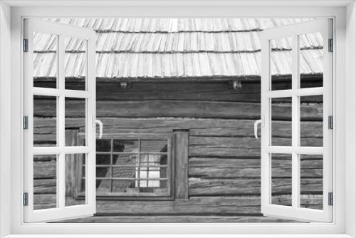 Fototapeta Naklejka Na Ścianę Okno 3D - windows and wooden roof of the traditional house made of clay and straw
