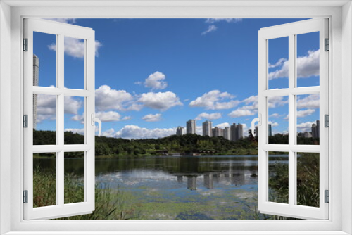 Fototapeta Naklejka Na Ścianę Okno 3D - A photo of a park lake and sky.