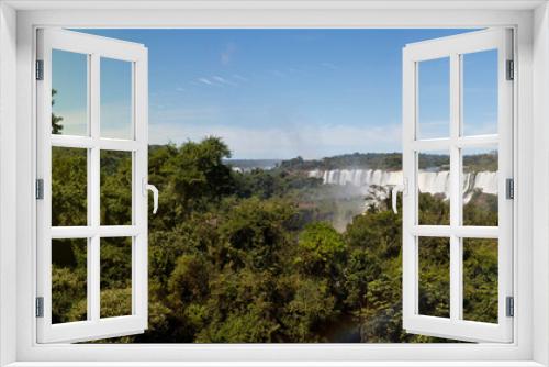 Fototapeta Naklejka Na Ścianę Okno 3D - Large nature panorama of Iguacu (Iguazu) waterfall cascade on border of Brazil and Argentina. Amazing view of falls Cataratas in bright Sunny weather. Concept of travel. Copyright space for site
