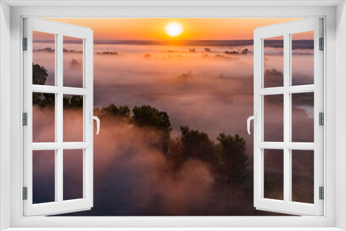Fototapeta Naklejka Na Ścianę Okno 3D - Beautiful panoramic landscape with river valley covered by thick fog in autumn in the early morning. Sunrise.
