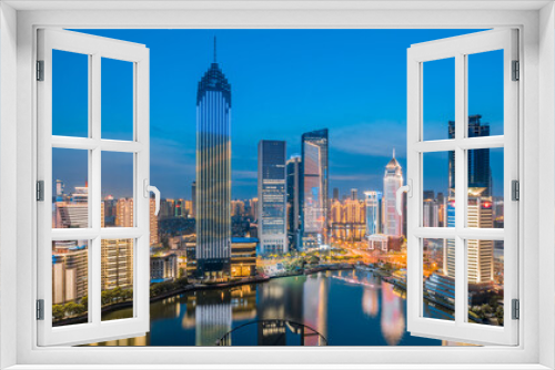 Fototapeta Naklejka Na Ścianę Okno 3D - Night view of CBD buildings in Northwest Lake, Hankou, Wuhan, Hubei, China