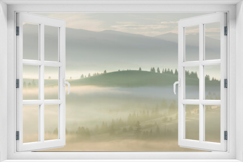 Fototapeta Naklejka Na Ścianę Okno 3D - Morning Foggy misty landscape with forest and trees in mountains valley