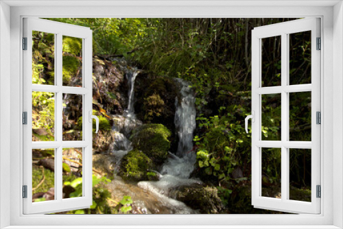 Fototapeta Naklejka Na Ścianę Okno 3D - Several small spring streams flow into the Protva River, forming small waterfalls on the slopes. The popular name of this picturesque place is 