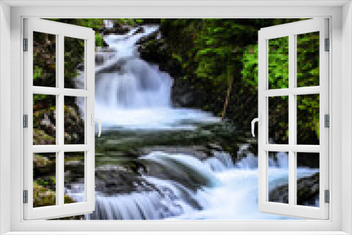 Fototapeta Naklejka Na Ścianę Okno 3D - Mountain brook waterfall time lapse