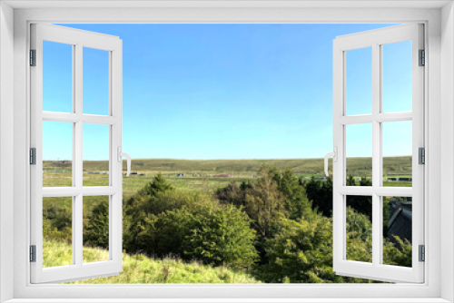 Fototapeta Naklejka Na Ścianę Okno 3D - Landscape view, looking from, Pike End Road, toward the M62 motorway, on a hot summers day near, Ripponden, Halifax, UK