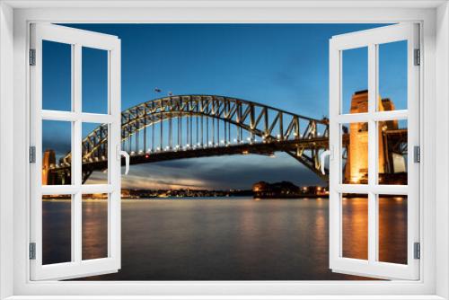 Fototapeta Naklejka Na Ścianę Okno 3D - Iconic Sydney Harbour Bridge at sunset with blue sky 
