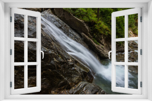 Fototapeta Naklejka Na Ścianę Okno 3D - high thin waterfall while hiking in a gorge