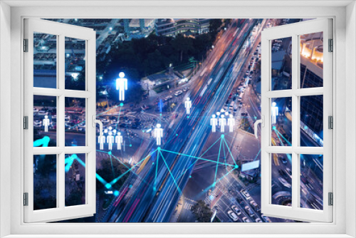 Fototapeta Naklejka Na Ścianę Okno 3D - Social media icons hologram on top view of road, busy urban traffic highway at night. Junction network of transportation infrastructure. The concept of networking and success. Double exposure.