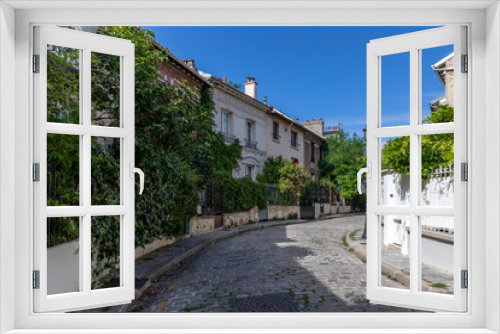Fototapeta Naklejka Na Ścianę Okno 3D - Paris, France - September 9, 2020: Beautiful old house, like in the countryside, in the center of Paris, in the area called 