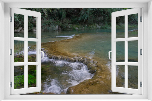 Fototapeta Naklejka Na Ścianę Okno 3D - small waterfalls produced by the river elsa in the fluvial park of colle di val d'elsa tuscany italy