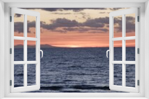 Fototapeta Naklejka Na Ścianę Okno 3D - Sunset, beach, sea, sand, clouds. Person silhouette