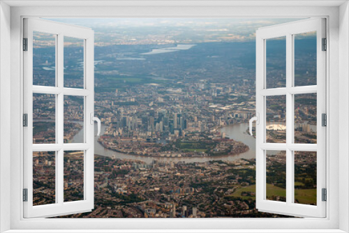 Overlooking the urban sprawl of the city of London from an airplane 