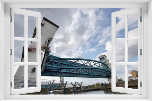 Fototapeta Naklejka Na Ścianę Okno 3D - Steel bridge and double water barrier in the river Hollandsche IJssel