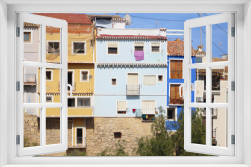 Fototapeta Naklejka Na Ścianę Okno 3D - Casas de colores sobre en río Amadorio, Villajoyosa, España