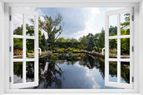 Fototapeta Naklejka Na Ścianę Okno 3D - Montreal, Canada - august 2020 : beautiful view of trees reflecting in a water pool in the botanical garden