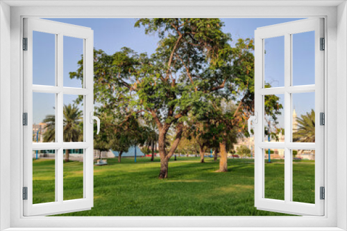 Fototapeta Naklejka Na Ścianę Okno 3D - Famous Abu Dhabi city corniche park, UAE - beautiful modern park scene at sunset - stress free view