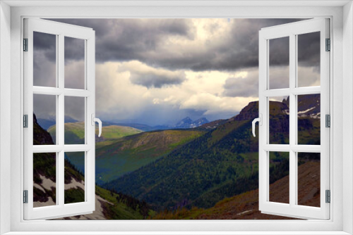 Fototapeta Naklejka Na Ścianę Okno 3D - Montana -Dark Clouds drifting over Going to the Sun Road Mountain Range