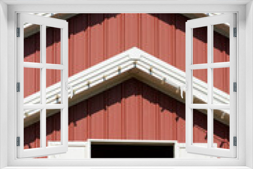 Fototapeta Naklejka Na Ścianę Okno 3D - Closeup of the hay loft doors on a red barn.