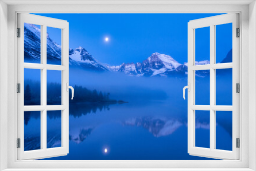 Fototapeta Naklejka Na Ścianę Okno 3D - Blue Light and Lake Mirror of Moon, Clouds and Mountains of Glacier National Park