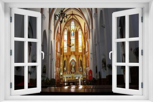 Hanoi, Vietnam, June 17, 2016: High altar from the benches of St. Joseph Cathedral built in 1886 in the neo-Gothic style. Hanoi, Vietnam