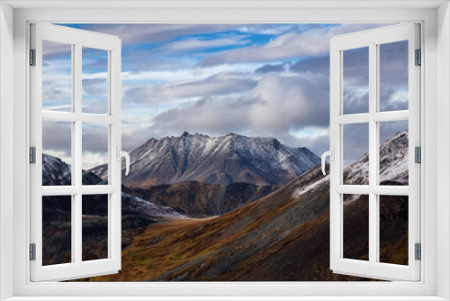 Fototapeta Naklejka Na Ścianę Okno 3D - Beautiful View of Scenic Mountains and Landscape in Canadian Nature. Season change from Fall to Winter. Taken in Tombstone Territorial Park, Yukon, Canada.