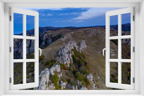 Fototapeta Naklejka Na Ścianę Okno 3D - beautiful mountains with unusual ledges and tales against the background of the sky and the valley