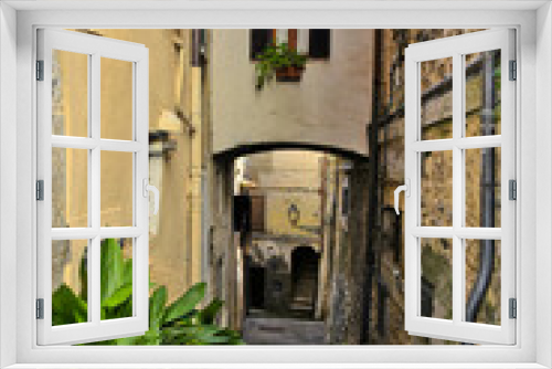 Fototapeta Naklejka Na Ścianę Okno 3D - An alley among the old houses of Fiuggi, a medieval village in the Lazio region.