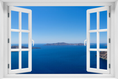 Fototapeta Naklejka Na Ścianę Okno 3D - Beautiful panoramic view from Thira to caldera and volcano on a sunny day. Picturesque natural background with copy space for text. Santorini island, Cyclades, Greece, Europe.